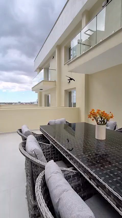Bellagio terrace with an outdoor dining table and rattan chairs