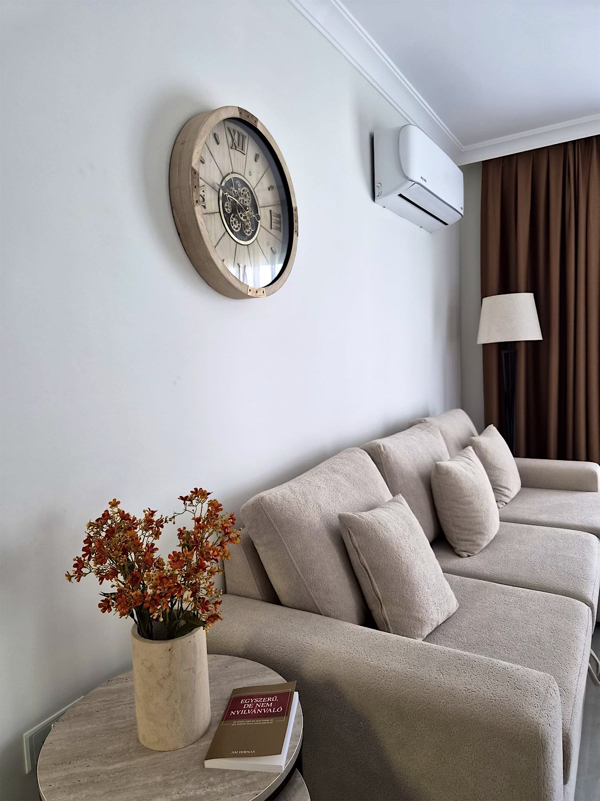Bellagio sofa with cushions, wall clock and side table